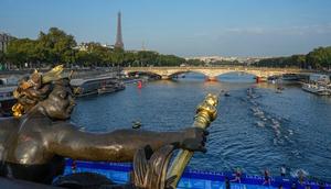 Athletes in the Seine during a test event for the Olympics in August 2023.Michel Euler/ AP