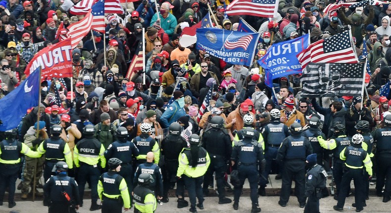 Trump supporters clash with police and security forces as they storm the US Capitol in Washington, DC, on January 6, 2021.