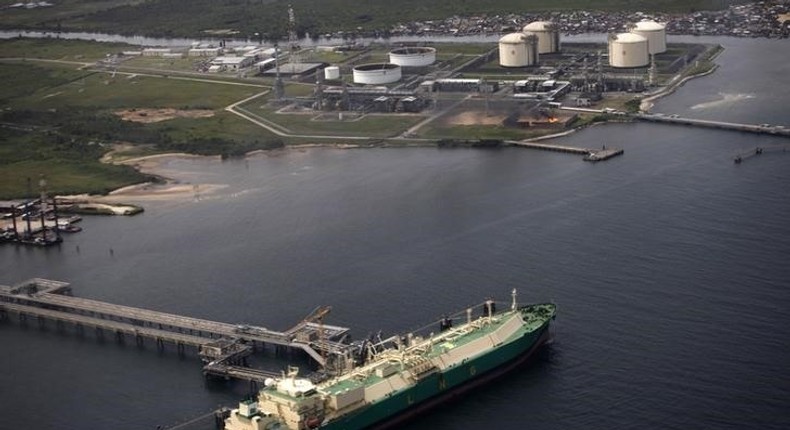 A ship berths near the Nigeria Liquified Natural Gas company (NLNG) near Finima village, during an aerial tour by the Royal Dutch Shell company, in Bonny March 22, 2013. REUTERS/Akintunde Akinleye