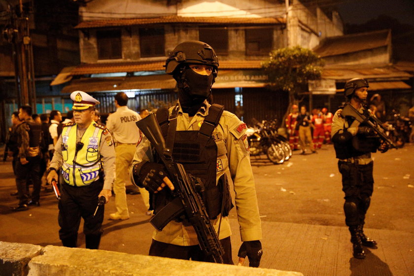 Police secure the area following an explosion at a bus stop in Kampung Melayu, East Jakarta, Indones