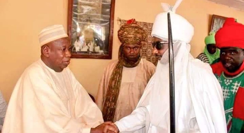 Kano State Governor, Dr Abdullahi Ganduje and Emir Sanusi Lamido shake hands (Dailytrust)