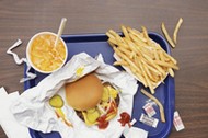 Elevated View of a Tray With Fries, a Hamburger and Lemonade