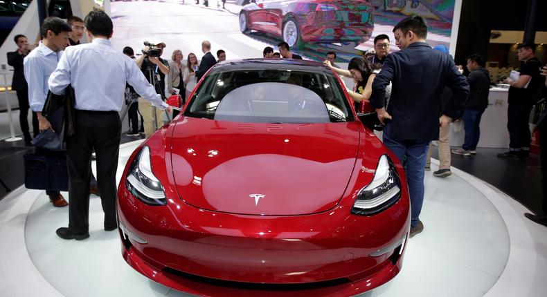 FILE PHOTO: A Tesla Model 3 car is displayed during a media preview at the Auto China 2018 motor show in Beijing, China April 25, 2018. REUTERS/Jason Lee