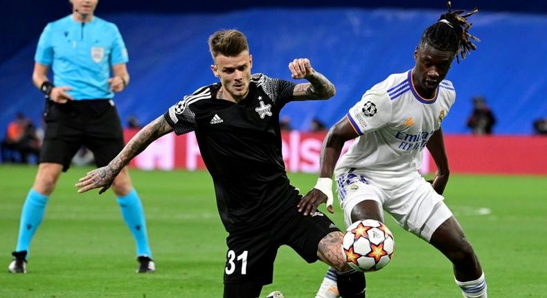 Sebastien Thill, in black, battling with Real Madrid's 30-million euro teenage midfielder Eduardo Camavinga Creator: JAVIER SORIANO