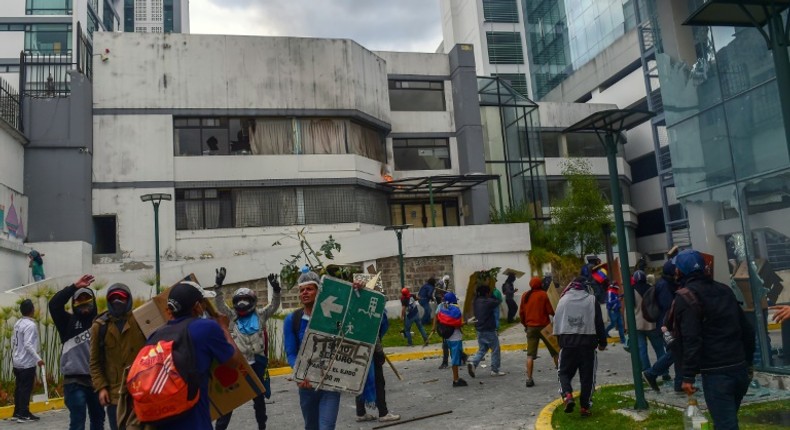 Demonstrators break into the General Comptrollers Office building during the 10th day of protests over a fuel price hike ordered by the government to secure an IMF loan