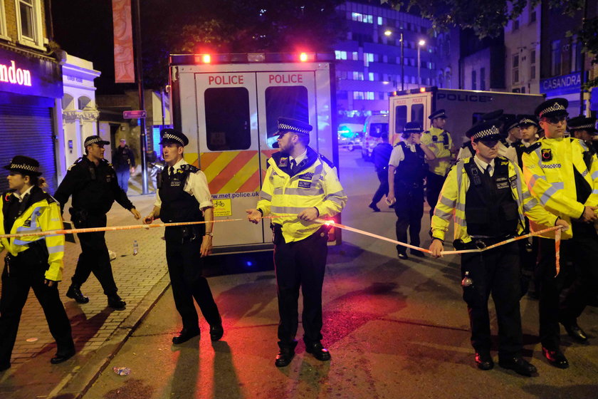 A man prays after a vehicle collided with pedestrians near a mosque in the Finsbury Park neighborhoo