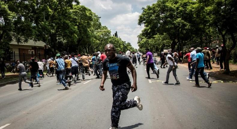 Police fire rubber bullets at demonstrators protesting outside the Democratic Republic of the Congo's Embassy in defiance of their President, Joseph Kabila on December 20, 2016 in Pretoria