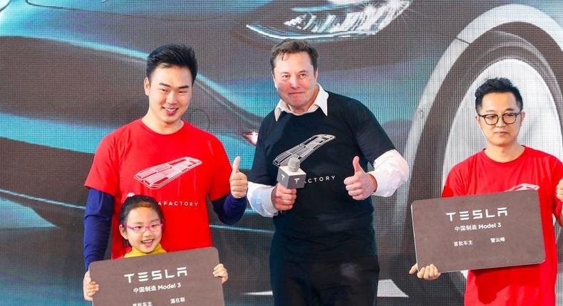 Tesla CEO Elon Musk (center) in Shanghai.
