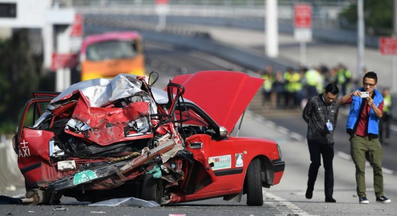 A taxi driver and two men and two women coach passengers were killed in the accident in Hong Kong