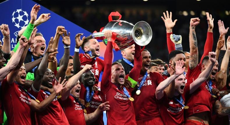 Liverpool captain Jordan Henderson lifts the Champions League trophy