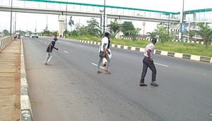 Crossing expressways in Lagos [The Guardian Nigeria]