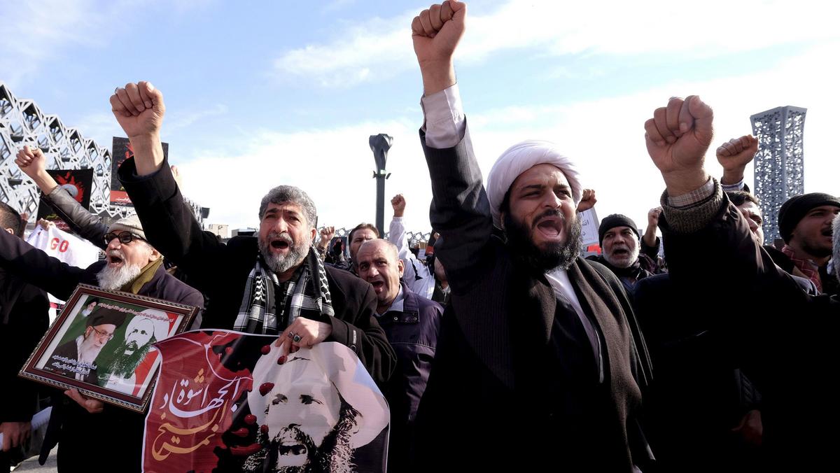 Iranian protesters chant slogans during a demonstration against the execution of Shi'ite cleric Shei