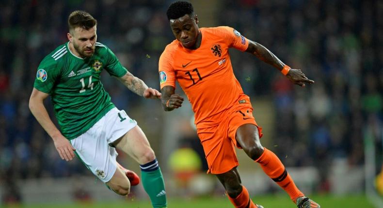 Netherlands winger Quincy Promes vies with Northern Ireland's Stuart Dallas during their goalless draw