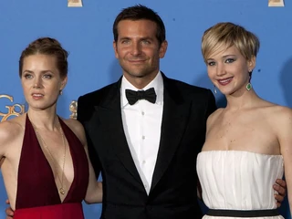 AMY ADAMS, BRADLEY COOPER, and JENNIFER LAWRENCE