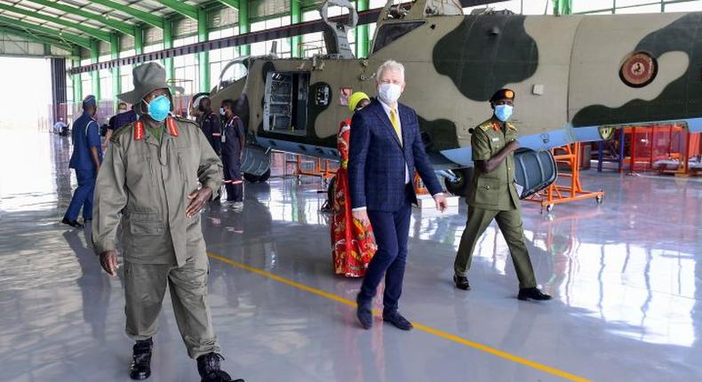 Left to right: President Yoweri Museveni, Valari Copcin, the Chief Executive Officer Pro-heli international services and Maj Gen Sabiiti Muzeyi, the General Manager of Luwero Industries Limited tour the facility. 