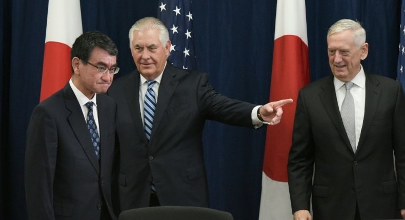 US Defense Secretary James Mattis (R) watches as US Secretary of State Rex Tillerson (C) shows the way to Japan's Foreign Minister Taro Kono ahead of the start of the US-Japan Security talks centered on North Korea