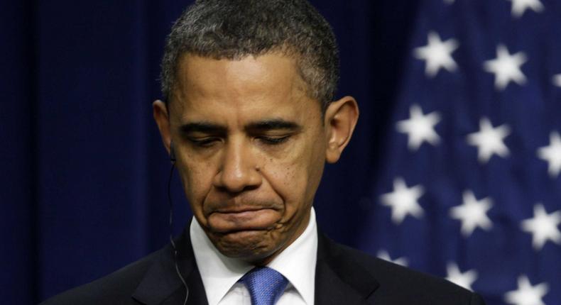 President Barack Obama pauses during his news conference with Iraq's Prime Minister Nouri al-Maliki, Monday, Dec. 12, 2011, in the South Court Auditorium on the White House complex in Washington