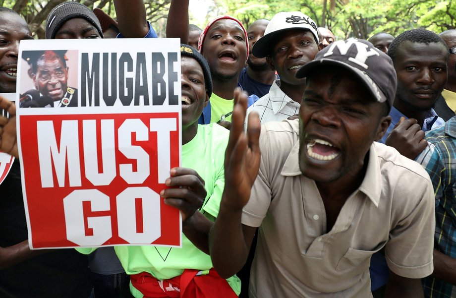 Crowds of anti-Mugabe protesters, seen near the parliament buildings in Harare.