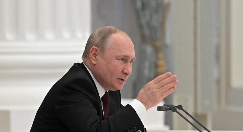 Russian President Vladimir Putin chairs a meeting with members of the Security Council in Moscow on February 21, 2022.