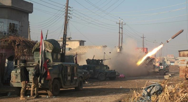 Iraqi forces launch a rocket in Mosul's eastern Al-Intisar neighbourhood on December 30, 2016, during an ongoing military operation against Islamic State (IS) group jihadists