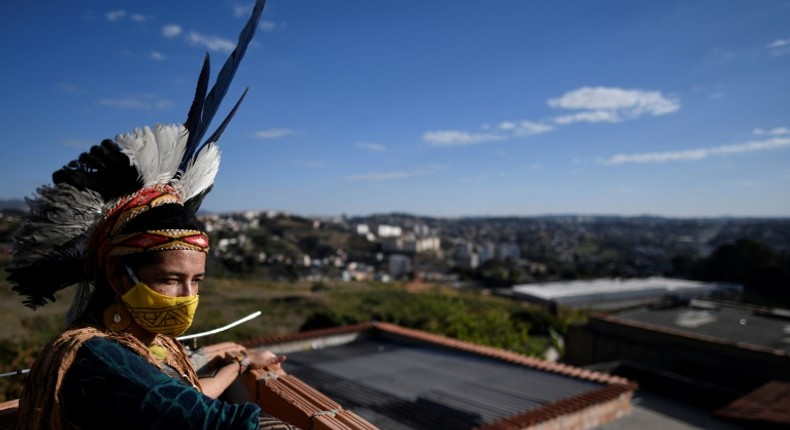 Angoho, an indigenous woman of the Pataxo Ha-ha-hae community, wears a face mask at the Vila Vitoria favela on the outskirts of Belo Horizonte, Brazil