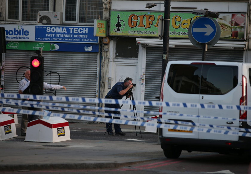 A man prays after a vehicle collided with pedestrians near a mosque in the Finsbury Park neighborhoo