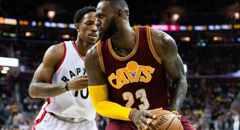 LeBron James of the Cleveland Cavaliers fights for position with Toronto's DeMar DeRozan on November 15, 2016