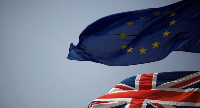 The Union Jack (bottom) and the European Union flag are seen flying, at the border of Gibraltar with Spain, in the British overseas territory of Gibraltar, historically claimed by Spain, June 27, 2016, after Britain voted to leave the European Union in the EU Brexit referendum. REUTERS/Jon Nazca