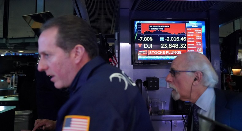 Traders work on the floor of the New York Stock Exchange (NYSE) in New York, U.S., March 9, 2020.