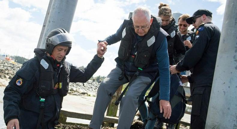 Stranded tourists are being evacuated from Kaikoura to a naval ship on November 16, 2016, after an earthquake hit New Zealand two days earlier