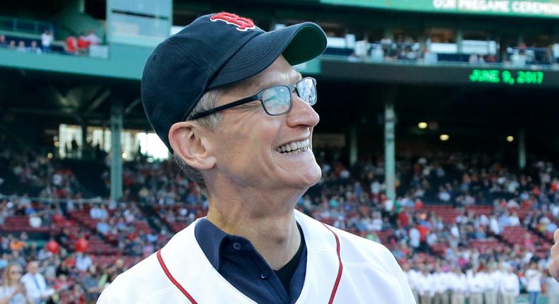 Apple CEO Tim Cook, left, chats with Boston Red Sox manager John Farrell before the Red Sox's baseball game against the Detroit Tigers at Fenway Park, Friday, June 9, 2017, in Boston