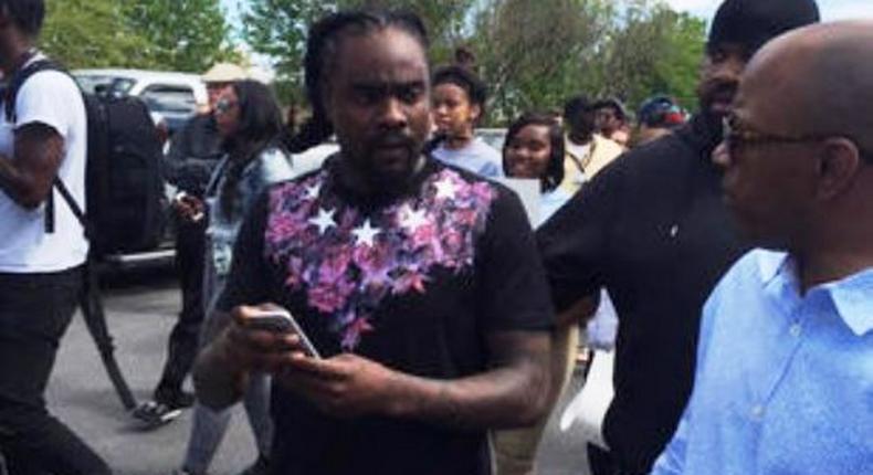 Wale discussing with residents of Baltimore