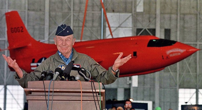 Retired Air Force General Chuck Yeager answers questions from the media, during a press conference honouring the 50th anniversary of his first supersonic flight, October 14 at Edwards Air Force Base, California. Yeager broke the sound barrier in 1947 in a Bell X-1 aircraft similar to the one behind him, nicknamed Glamorous Glennis.