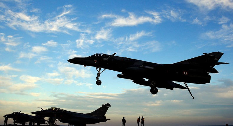 A Super Etendard fighter jet landing on France's flagship Charles de Gaulle aircraft carrier in the Persian Gulf on January 12, 2016.AP Photo/Christophe Ena