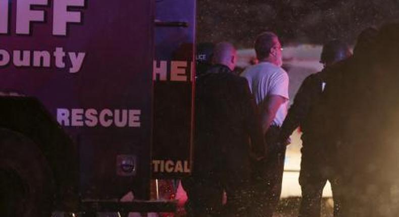 A suspect is taken into custody outside a Planned Parenthood center in Colorado Springs, Colorado November 27, 2015.