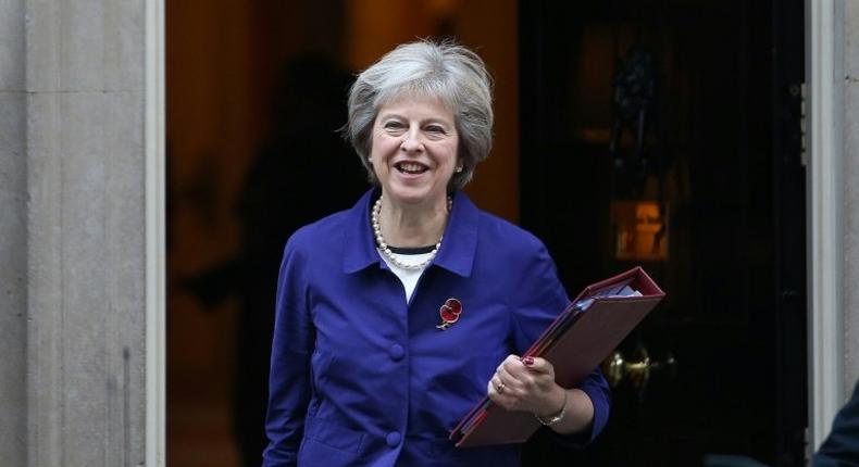 British Prime Minister Theresa May (L) emphasised to president-elect Donald Trump her wish to strengthen trade and investment with the US