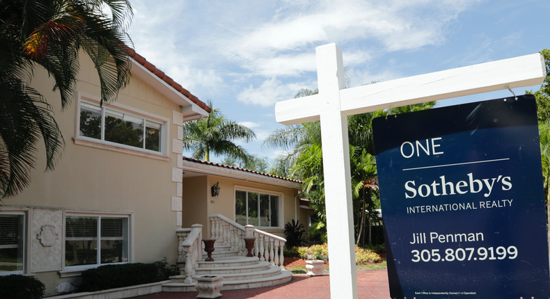 FILE - In this July 22, 2019 photo, a for sale sign is posted in front of a home in Miami. On Thursday, Aug. 8, Freddie Mac reports on this weeks average U.S. mortgage rates. (AP Photo/Lynne Sladky, File)