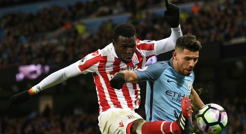 Stoke City's striker Mame Biram Diouf (L) vies with Manchester City's striker Sergio Aguero during a English Premier League football match at the Etihad Stadium in Manchester, north west England, on March 8, 2017