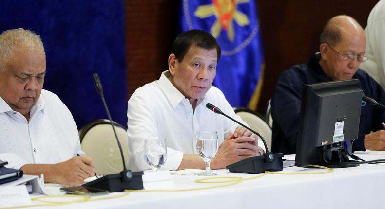 In this Jan. 7, 2020, photo provided by the Malacanang Presidential Photographers Division, Philippine President Rodrigo Duterte, center, talks during the Joint Armed Forces of the Philippines-Philippine National Police (AFP-PNP) Command Conference at the Malacanang presidential palace in Manila, Philippines. The Philippine government has ordered the mandatory evacuation of Filipino workers from Iraq and is sending a coast guard vessel to the Middle East to rapidly ferry its citizens to safety in case hostilities between the United States and Iran worsen, officials said Wednesday. (Alfred Frias/ Malacanang Presidential Photographers Division via AP)