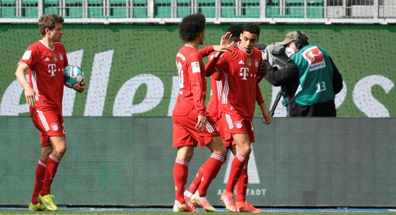 Bayern Munich Jamal Musiala (R) celebrates scoring against Wolfsburg on Saturday