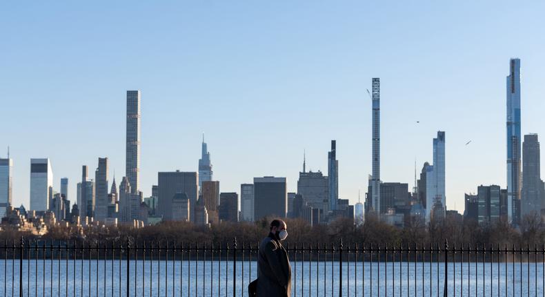 A person walks past Billionaire's Row in New York City on March 13, 2021.