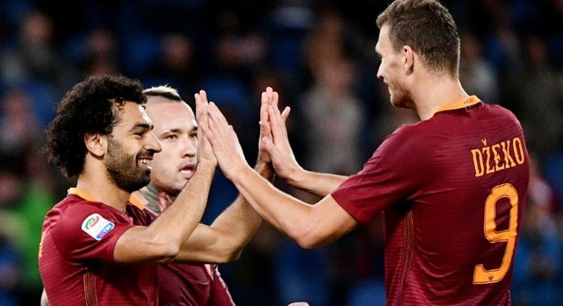 AS Roma's forward Mohamed Salah (L) celebrates with teammates Edin Dzeko (R) and Radja Nainggolan after scoring on November 6, 2016