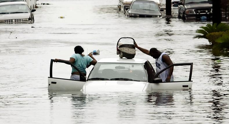 More than 1,800 people are thought to have died in Hurricane Katrina in the South in 2005, though there isn't an official death toll. Here people abandoned their car in New Orleans.