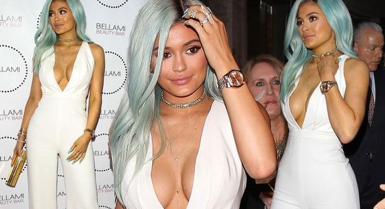 Kylie Jenner steps out in white with blue hair & massive cleavage