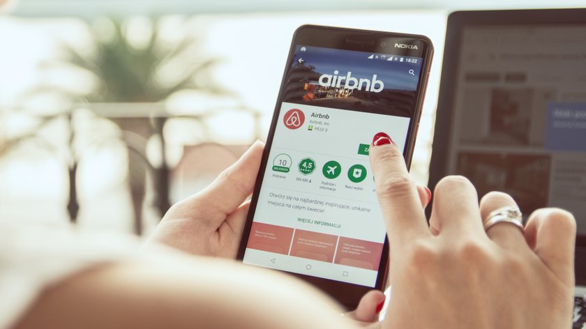 TROGIR, CROATIA - SEPTEMBER 13th, 2018: Woman is installing Airbnb application on Nokia smartphone.