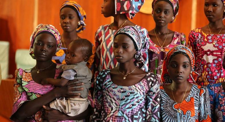 One of the 21 Chibok school girls released by Boko Haram carries her baby during their visit to meet President Muhammadu Buhari In Abuja, Nigeria. REUTERS/Afolabi Sotunde