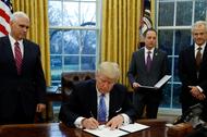 President Trump signs executive orders at the White House in Washington