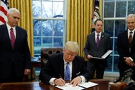 President Trump signs executive orders at the White House in Washington