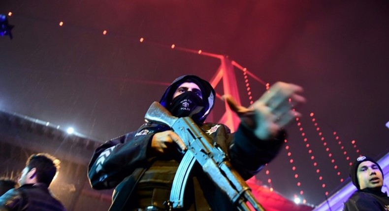 Turkish police officers on duty at the site of an armed attack in Istanbul on January 1, 2017