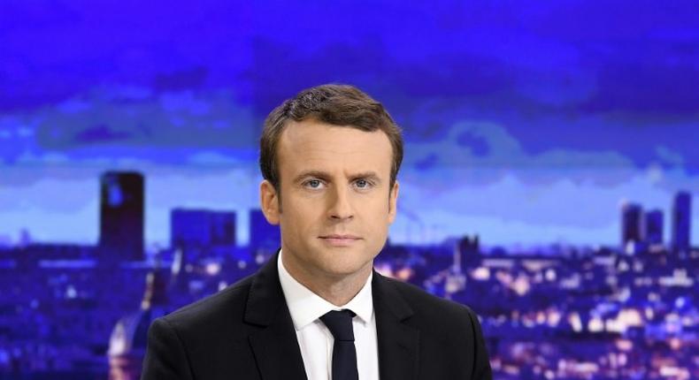 French presidential election candidate for the En Marche ! movement Emmanuel Macron waits before an interview on the set of the French channel France 2 news evening broadcast on April 25, 2017 in Paris